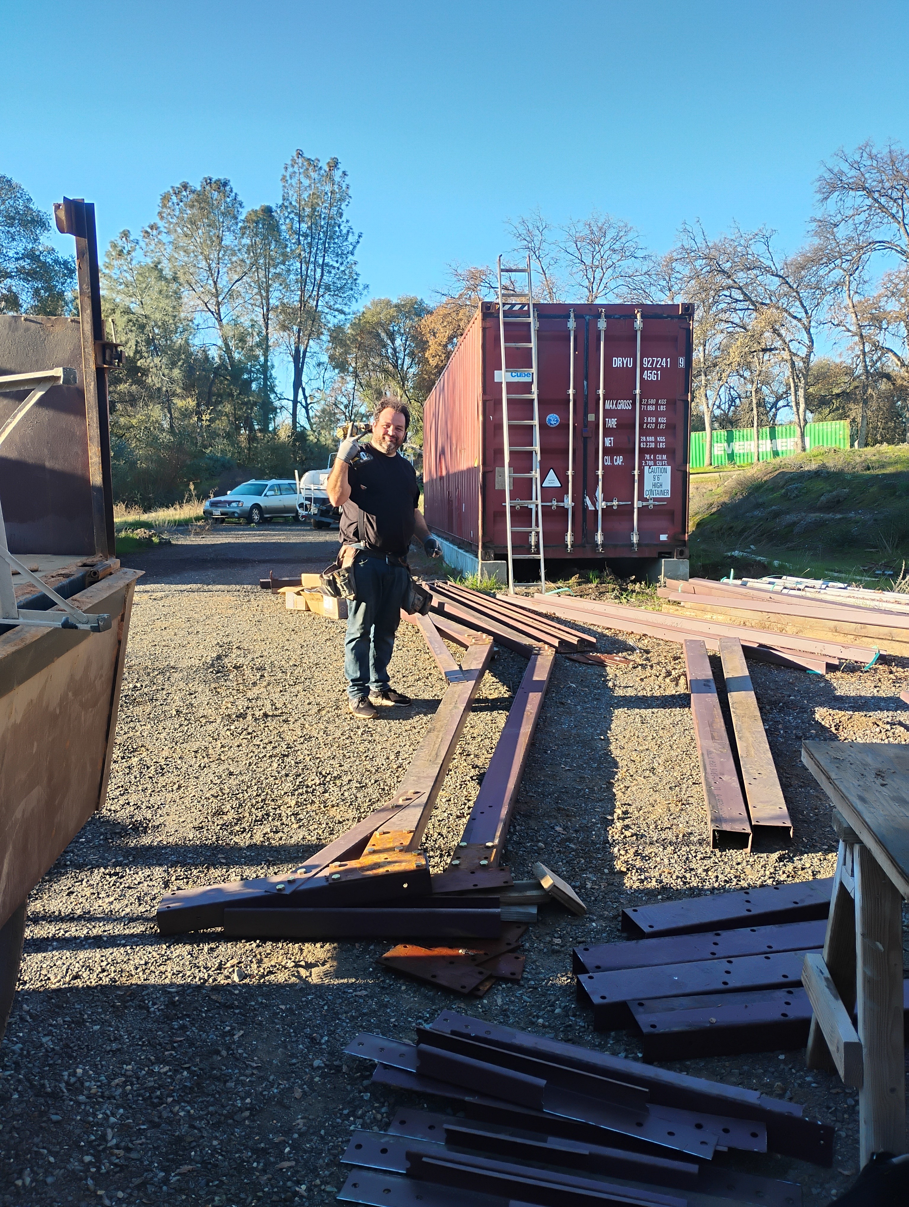 Metal building frame materials staged for construction in Mariposa CA