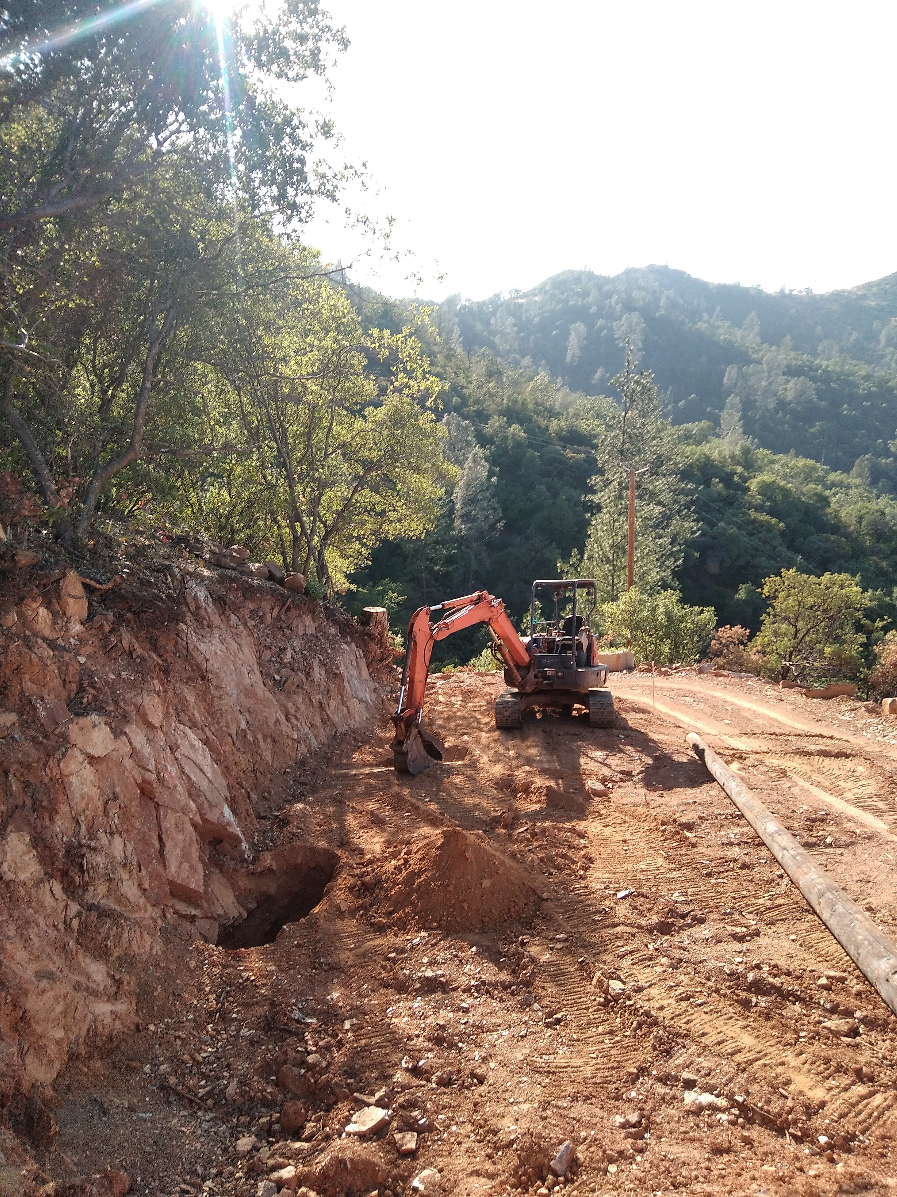 Hillside road cut and grading work in Mariposa County