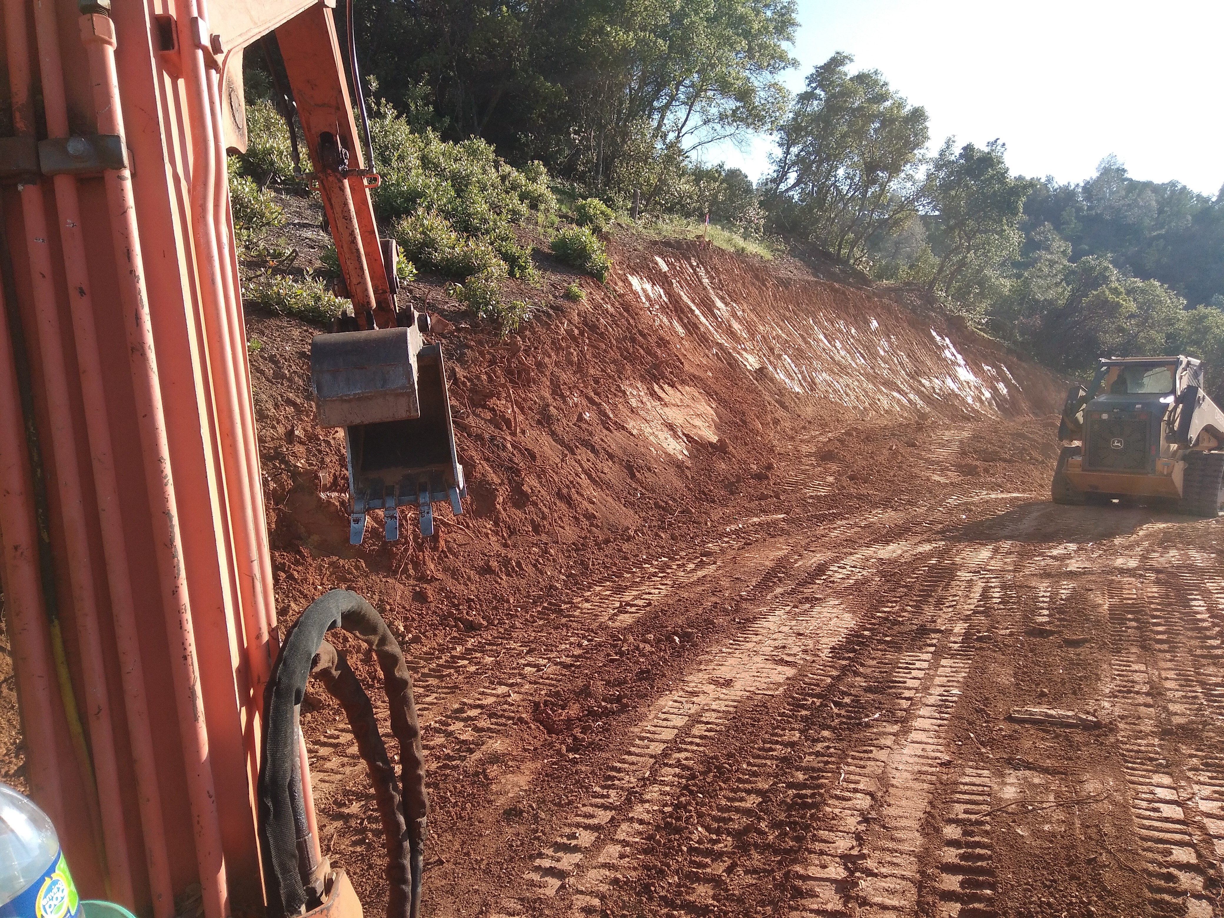 Road grading and compaction on hillside property